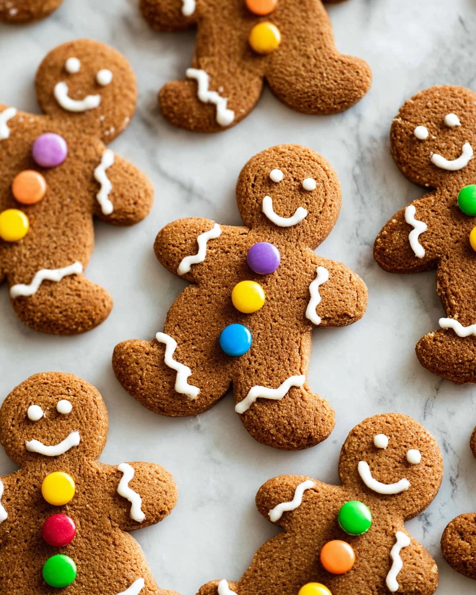 The image shows several gingerbread cookies shaped like people arranged on a white marbled surface. Each cookie has brown textured dough with white icing used to make smiling faces and wavy lines on the arms and legs. Some of the gingerbread people have colorful round candy buttons in the center of their bodies, with colors including red, yellow, purple, blue, and green. The overall look is warm and festive, with a clear focus on the detailed icing and candy decorations on each cookie photo taken with an iphone --ar 4:5 --v 7