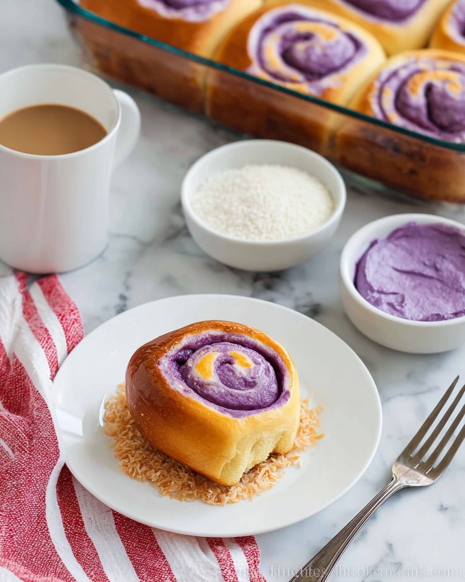 The image shows a round swirl bun with a golden-brown top layer and a purple spiral filling inside, sitting on a small bed of shredded toasted coconut on a clean white plate. To the top left is a clear glass baking dish filled with several similar swirl buns, evenly spaced and golden on top. Surrounding this main scene is a small white bowl of shredded coconut, a small white bowl with bright purple mashed filling, a white cup and saucer of espresso coffee, and a silver fork on the bottom right. All items rest on a wooden table partially covered by a white and red striped cloth, with the visible surface being a white marbled texture photo taken with an iphone --ar 4:5 --v 7