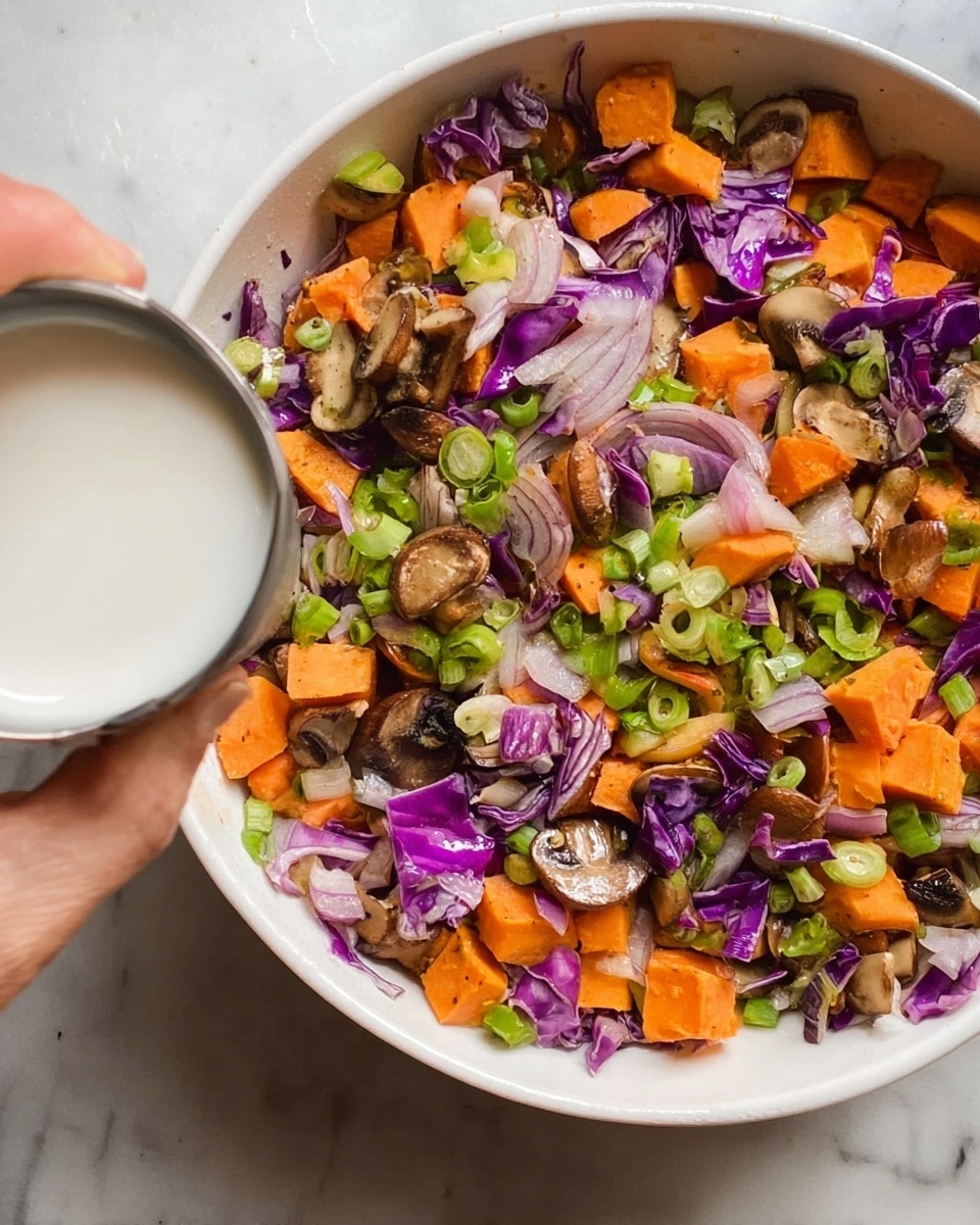 A white plate holds a dish with two main layers: the bottom layer is a bed of fluffy white rice with soft texture, and the top layer features a colorful mix of cooked vegetables including orange carrot slices, thin purple cabbage, and brown mushrooms. Small green herb strips are scattered over the top, alongside tiny white sesame seeds. A silver spoon rests on the plate, angled into the rice and vegetable mix. The plate sits on a white marbled surface. Photo taken with an iphone --ar 4:5 --v 7