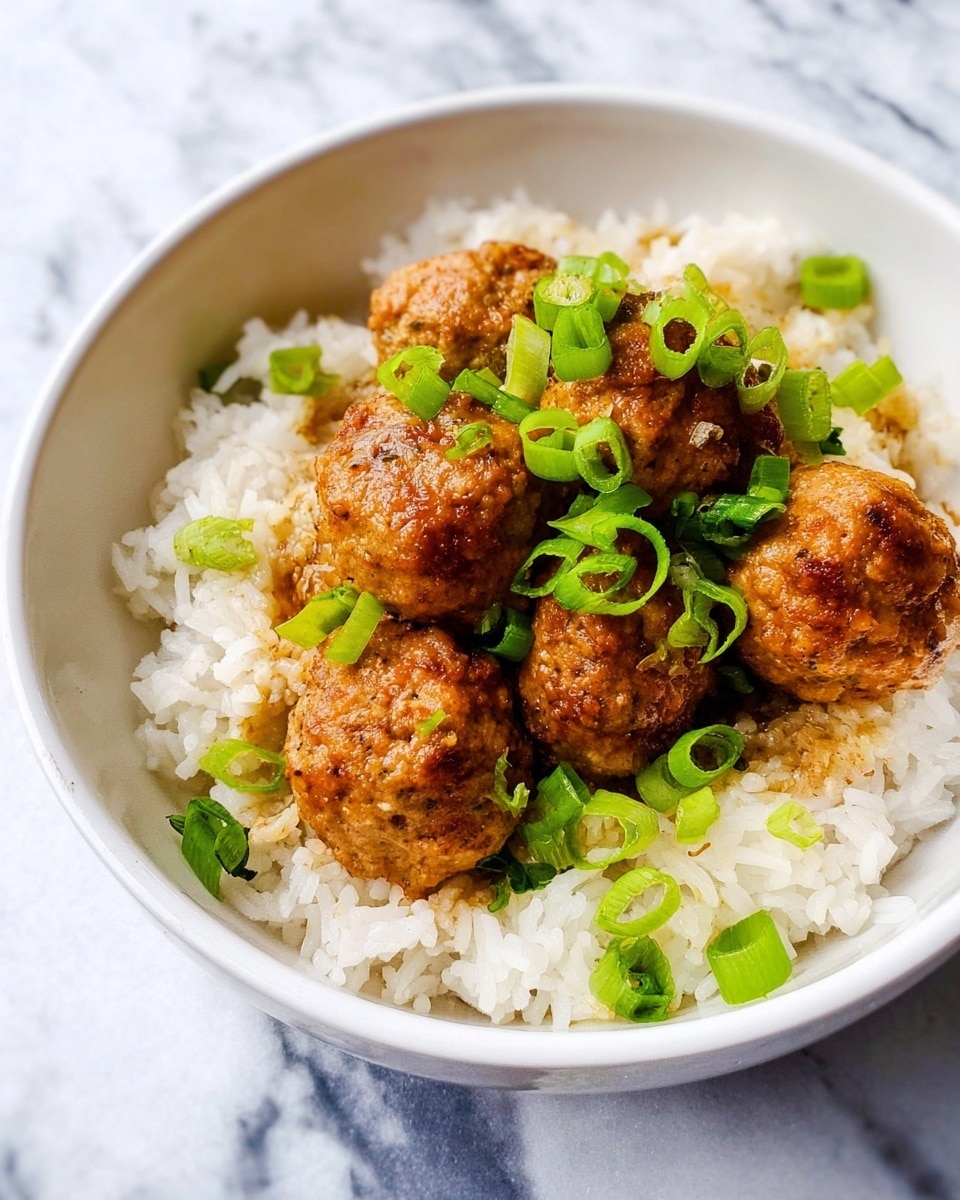 A white speckled plate holds a base layer of fluffy, white rice that spreads evenly across the plate. On top, there are several pieces of golden brown chicken, cooked and coated in a sauce, arranged in the center. Small, bright green chopped scallions are sprinkled over the chicken and rice, adding a fresh pop of color. Around the plate, tiny bits of scallions are scattered on the white marbled surface. Above the plate, a white bowl filled with more chopped scallions sits next to a white dish with some yellow scrambled eggs. A blue and white striped cloth napkin lies casually on the right side of the scene. Photo taken with an iphone --ar 4:5 --v 7
