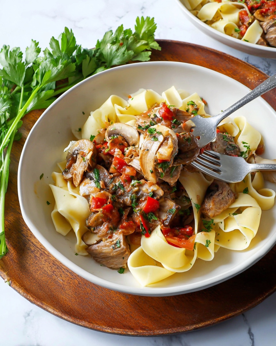 Two white bowls with brown rims are filled with broad yellow pasta noodles at the base, topped with cooked chicken pieces and a chunky tomato-based vegetable sauce containing red peppers, mushrooms, and onions. Fresh green parsley is sprinkled on top as garnish. One bowl is placed directly on a white marbled surface, while the other bowl sits on a wooden round board with a handle, accompanied by a bunch of fresh parsley beside it and a light beige cloth nearby. The scene is bright and airy with soft natural light. Photo taken with an iphone --ar 4:5 --v 7