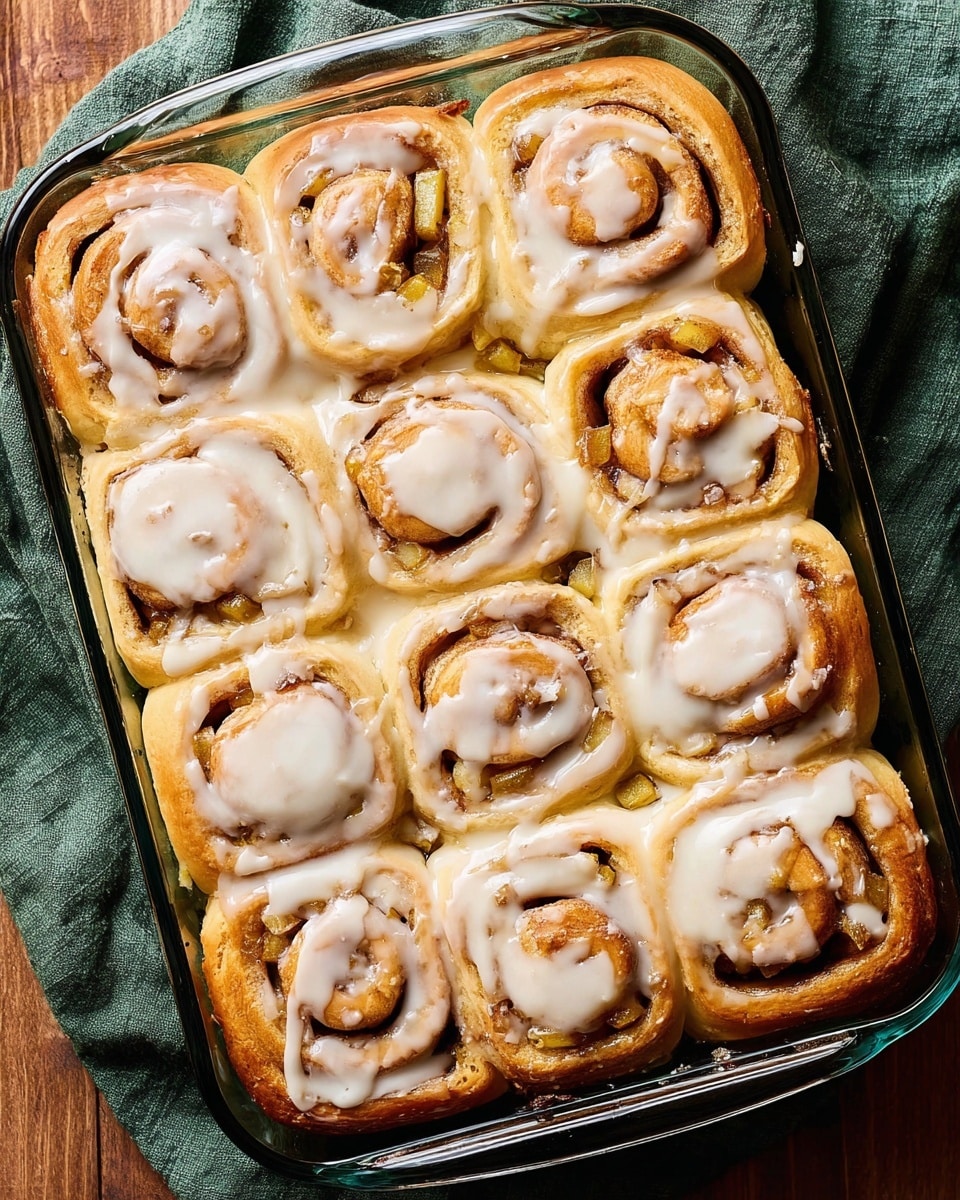 The image shows two green apples at the top left, two white eggs placed below them on a white marbled surface with a dark green cloth underneath. Next to the eggs are two packets of platinum baking yeast in white packets with red and blue text. On the bottom right, there is a white bowl with a red floral pattern on the inside, holding two cubes of butter with a smooth, creamy texture. The scene is simple, with a mix of smooth and textured elements arranged casually. photo taken with an iphone --ar 4:5 --v 7