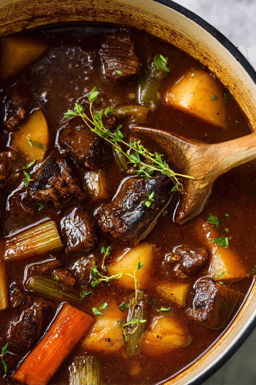 Rich Beef Stew with Red Wine Recipe 5 The image shows a pot filled with a dark brown stew containing chunks of tender meat, thick orange carrot pieces, light green celery, and golden brown potato quarters. Some fresh green thyme sprigs rest on top, adding a touch of color. A wooden spoon is dipped into the stew on the right side, showing the glossy, rich broth that coats all the ingredients. The pot is white and sits on a white marbled surface. photo taken with an iphone --ar 4:5 --v 7