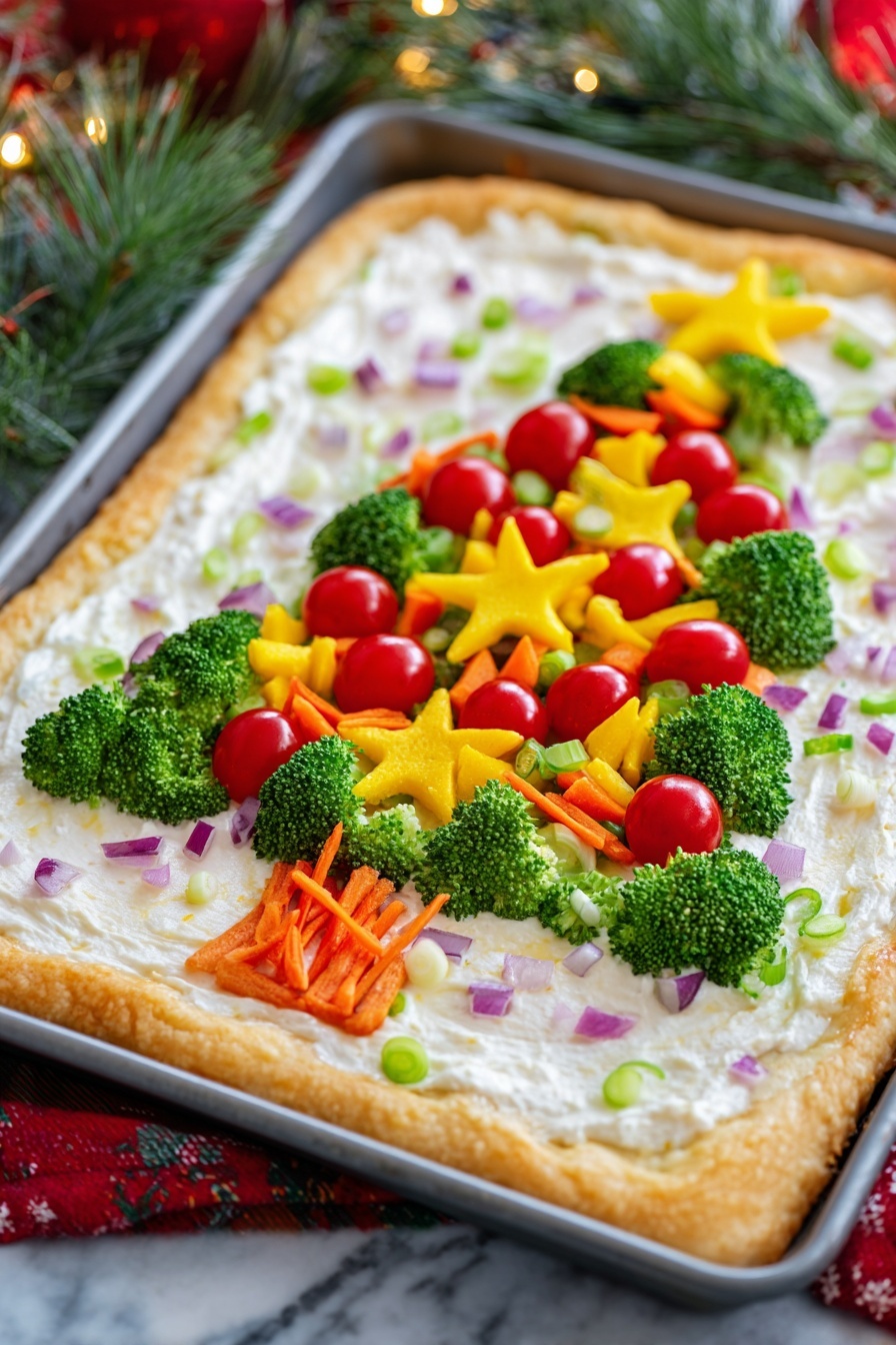 A rectangular baked dish with a thick golden brown crust frames a creamy white base mixed with small chopped purple onions and green scallions. On top, bright green broccoli florets are carefully arranged in the shape of a Christmas tree. The tree is decorated with small round red cherry tomatoes and star-shaped yellow and red bell pepper pieces. Thin orange strips, likely carrot, are scattered across the tree to resemble garlands. The dish is set on a white marbled surface with a red onion to the top left, a red bell pepper to the top right, a bunch of green onions to the bottom left, and a yellow bell pepper to the bottom right. photo taken with an iphone --ar 4:5 --v 7