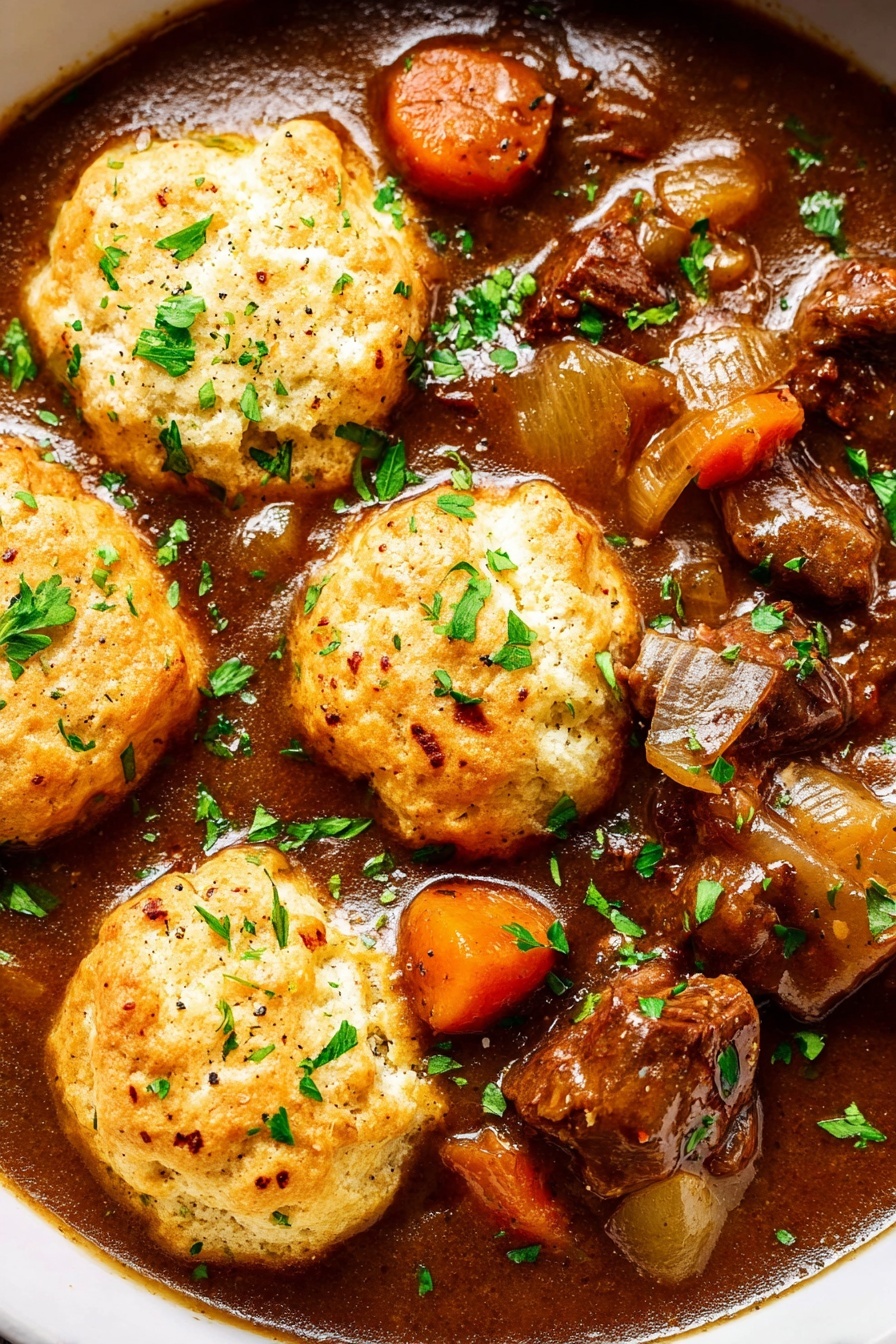 Slow Cooker Beef Stew with Dumplings Recipe 8 This close-up image shows a rich brown stew filled with chunks of tender meat and bright orange carrot pieces. On top, there are five round, light golden biscuits with a slightly crispy texture, each sprinkled with fresh green parsley leaves that add a pop of color. The thick brown gravy looks smooth and shiny, surrounding the ingredients, with small pieces of onion visible. The whole dish is on a white marbled surface. photo taken with an iphone --ar 2:3 --v 7 - Slow Cooker Beef Stew with Dumplings, hearty beef stew recipe, easy slow cooker beef stew, comforting beef and veggie stew, cheesy dumplings recipe