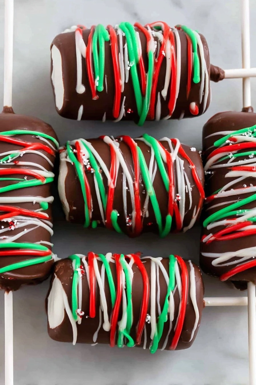 The image shows six chocolate-covered marshmallows on white sticks, stacked in a row on a white rectangular plate set on a white marbled surface. Each marshmallow skewer has three white marshmallows coated fully in dark brown chocolate, with festive thin lines of red, green, and white icing drizzled around them in a spiral pattern. The plate is placed close to colorful red, green, and white felt snowflake decorations in the background. The overall look is festive and colorful with smooth chocolate and bright icing colors. photo taken with an iphone --ar 2:3 --v 7 - Festive Chocolate Marshmallow Pops, Christmas Marshmallow Treats, Holiday Candy Pops, Easy Festive Dessert Ideas, Christmas Party Snacks