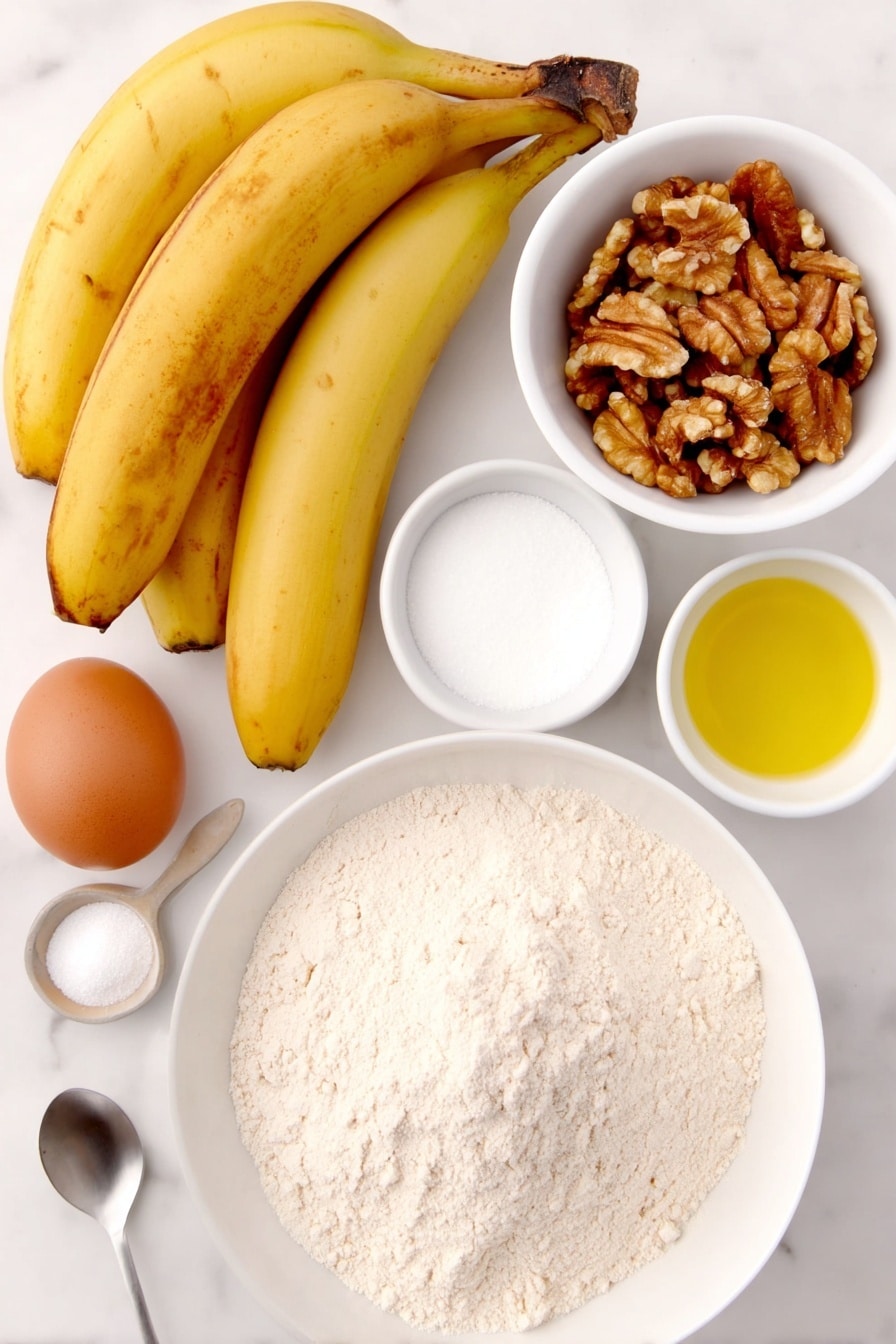Perfect Banana Nut Bread Recipe 7 Flat lay of a small mound of all-purpose flour in a simple white ceramic bowl, a teaspoon of baking soda beside a small pile of coarse salt, a small heap of ground cinnamon on the side, one whole brown egg with a clean shell, a small white bowl filled with granulated sugar, a small white bowl holding golden vegetable oil, a small white bowl containing buttermilk, a small white bowl with clear vanilla extract, three extra ripe bananas with vibrant yellow skins and brown spots, and half a cup of roughly chopped walnuts arranged neatly beside the bowls, all placed on a clean white marble surface, soft natural light, photo taken with an iPhone, professional food photography style, fresh ingredients, white ceramic bowls, no bottles, no duplicates, no utensils, no packaging --ar 2:3 --v 7 --p m7354615311229779997 - Perfect Banana Nut Bread, banana nut bread recipe, moist banana bread, easy banana bread, homemade banana bread