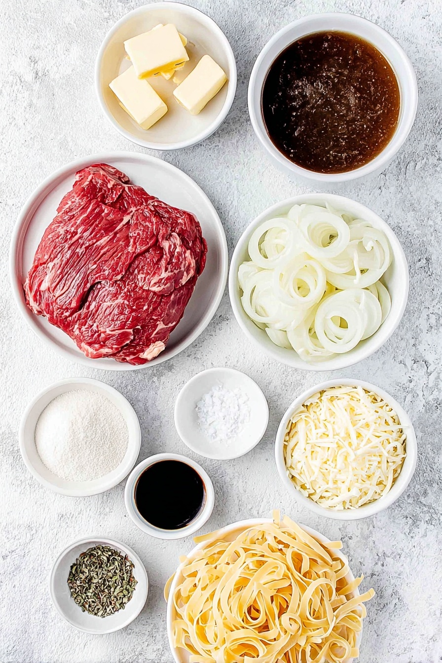 French Onion Noodle Soup Recipe 7 Flat lay of a small white ceramic bowl of salted butter, a pile of sweet yellow onions sliced into thin rings, a small white ceramic bowl filled with rich brown beef broth, a small white bowl with amber cooking sherry, a few dried brown bay leaves, two fresh green thyme sprigs, a neat mound of uncooked wide egg noodles, a small white bowl of pale yellow all-purpose flour, a small white bowl of granulated white sugar, a small white bowl of coarse salt, a small white bowl of dark Worcestershire sauce, and a small pile of shredded Swiss and Gruyere cheese mixed together all arranged symmetrically on a simple white ceramic plate placed on a clean white marble surface, soft natural light, photo taken with an iPhone, professional food photography style, fresh ingredients, white ceramic bowls, no bottles, no duplicates, no utensils, no packaging --ar 2:3 --v 7 --p m7354615311229779997 - French Onion Noodle Soup, onion noodle soup, comforting French onion dish, easy French onion soup, cozy noodle soup