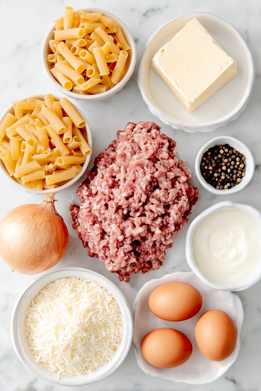 Creamy Beef Pasta Recipe 7 Flat lay of unsalted butter pat, a pile of raw grass-fed ground beef, a large whole shallot with papery skin, dried rigatoni pasta, a small white bowl of chicken broth, a small white bowl of heavy whipping cream, shredded sharp white cheddar cheese mound, freshly grated parmesan cheese heap, whole brown eggs with clean shells, coarse kosher salt crystals, and whole black peppercorns arranged in simple white ceramic bowls and plates, balanced and symmetrical composition, placed on a clean white marble surface, soft natural light, photo taken with an iPhone, professional food photography style, fresh ingredients, white ceramic bowls, no bottles, no duplicates, no utensils, no packaging --ar 2:3 --v 7 --p m7354615311229779997 - Creamy Beef Pasta, creamy beef pasta recipe, hearty beef pasta dish, easy beef pasta dinner, cheesy beef pasta