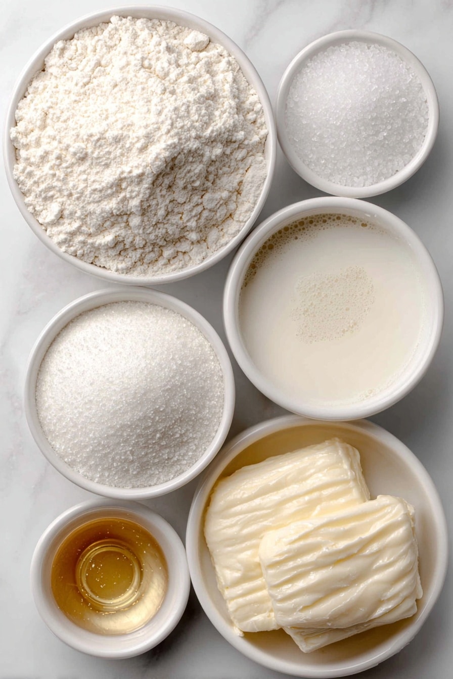 Vegan Pancake Recipe 7 Flat lay of a small mound of all-purpose flour, a small white bowl of baking powder powder, a small white bowl with some salt crystals, a small white bowl filled with creamy non-dairy milk, a small white bowl with melted golden vegan butter, a small white bowl containing clear to pale vanilla extract, placed on a clean white marble surface, soft natural light, photo taken with an iPhone, professional food photography style, fresh ingredients, white ceramic bowls, no bottles, no duplicates, no utensils, no packaging --ar 2:3 --v 7 --p m7354615311229779997 - Vegan Pancake Recipe, fluffy vegan pancakes, plant-based breakfast, easy vegan pancake ideas, dairy-free vegan pancakes