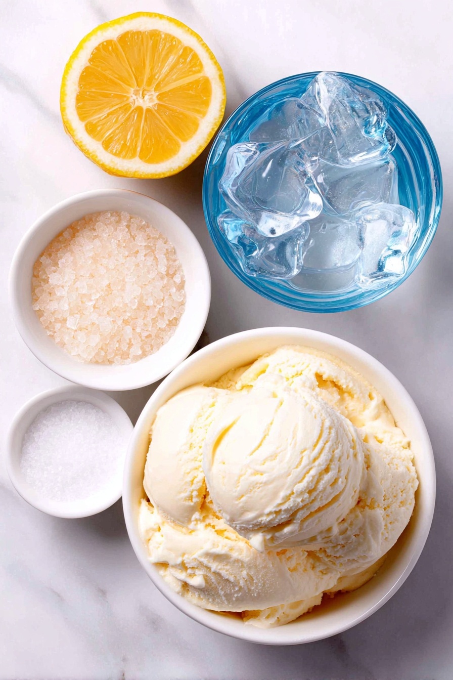 Copycat Frosted Lemonade Recipe 7 Flat lay of a halved bright yellow lemon with visible pulp, a small white ceramic bowl filled with granulated white sugar, a small white ceramic bowl of clear water, and a large scoop of creamy vanilla ice cream served in a simple white ceramic bowl, all arranged symmetrically and balanced, placed on a clean white marble surface, soft natural light, photo taken with an iPhone, professional food photography style, fresh ingredients, white ceramic bowls, no bottles, no duplicates, no utensils, no packaging --ar 2:3 --v 7 --p m7354615311229779997 - Frosted Lemonade, Copycat Frosted Lemonade, Chick-fil-A Lemonade Drink, Homemade Lemonade Dessert, Summer Lemonade Refreshment